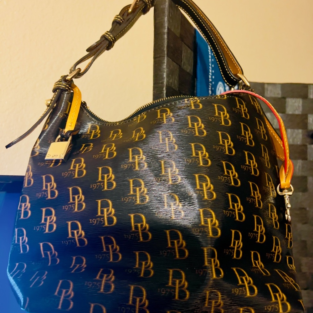 Dooney & Bourke Black Hobo Bag with Monogram Pattern and Slouchy Shape